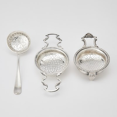 Lot 157 - Two George II/III Sterling Silver Punch Strainers and a Continental Silver Sugar Sifter