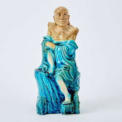 Lot 559 - A Chinese Turquoise Glazed Biscuit Figure of a Luohan