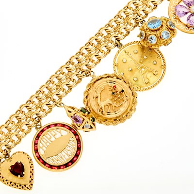 Lot 2098 - Two-Color Gold and Gem-Set Charm Bracelet