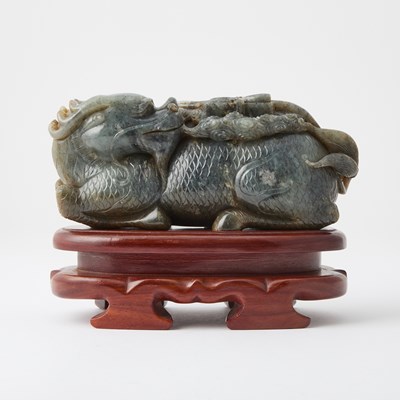 Lot 323 - A Chinese Mottled Jade Figural Carving of a Qilin