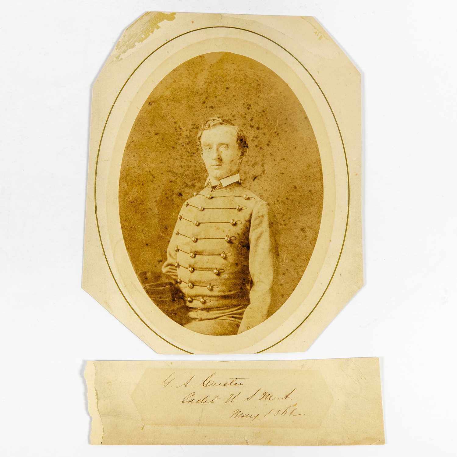 Lot 303 - An early photograph of Custer at West Point, including a slip with his bold signature