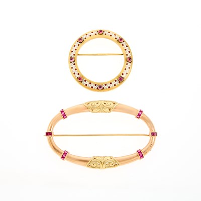 Lot 2130 - Gold, Enamel and Cabochon Ruby Circle Pin and Two-Color Gold and Synthetic Ruby Brooch