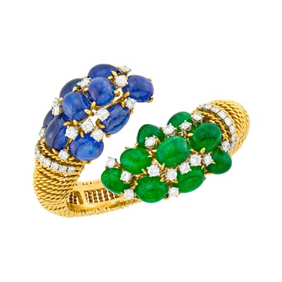 Lot 141 - David Webb Gold, Platinum, Cabochon Sapphire and Emerald and Diamond Crossover Bangle-Bracelet/Pair of Clip-Brooches Combination