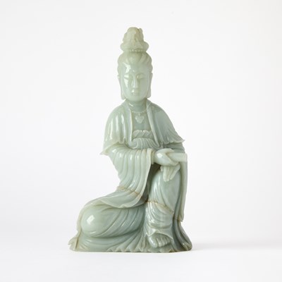 Lot 36 - A Chinese Celadon Jade Figure of Seated Guanyin