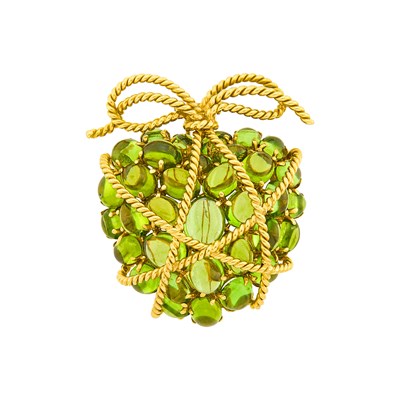 Lot 90 - Verdura Gold and Cabochon Peridot 'Wrapped Heart' Pendant Clip-Brooch