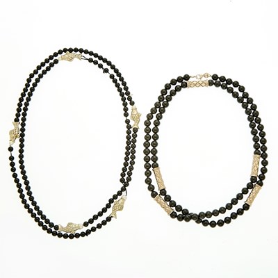 Lot 2044 - Tiffany & Co. Two Long Black Onyx Bead, Freshwater Pearl and Silver Necklaces