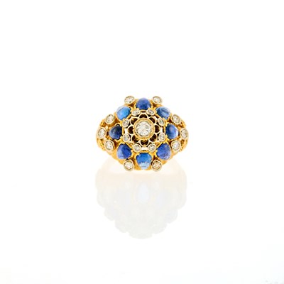 Lot 2148 - Two-Color Gold, Diamond and Cabochon Sapphire Dome Ring
