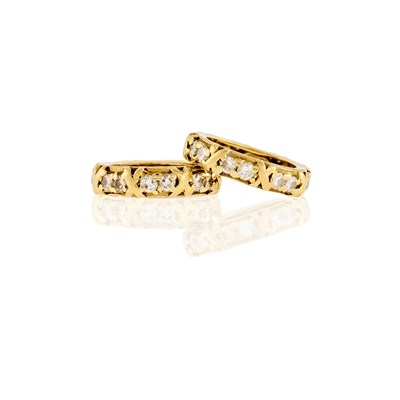 Lot 159 - Tiffany & Co., Schlumberger Pair of Gold and Diamond 'X' Band Rings