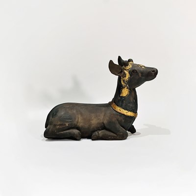 Lot 1079 - Carved Wood and Parcel Gilt Figure of a Recumbent Deer