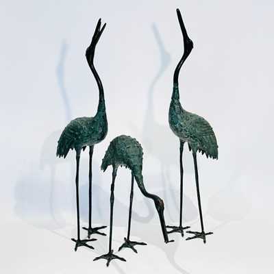 Lot 1115 - Three Patinated Metal Figures of Cranes