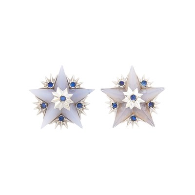 Lot 98 - Tiffany & Co., Schlumberger Pair of White Gold, Carved Blue Chalcedony and Moonstone Star Earclips, France