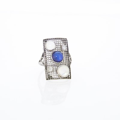 Lot 2308 - Platinum, Cabochon Sapphire, Moonstone and Diamond Filigree Ring