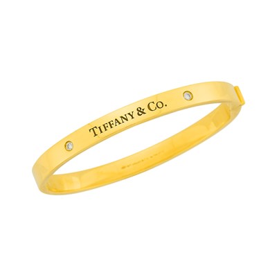 Lot 1003 - Tiffany & Co. Gold and Diamond Bangle Bracelet