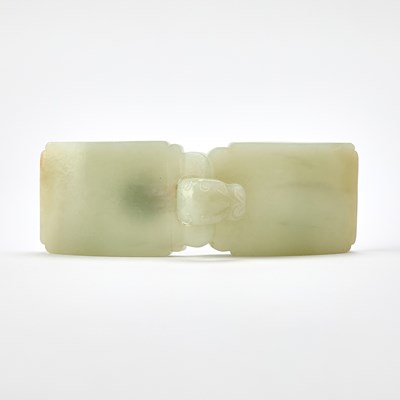 Lot 27 - A Chinese Celadon Jade Two-Part Buckle