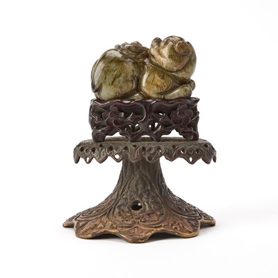 Lot 361 - A Chinese Carved Mottled Jade Beast