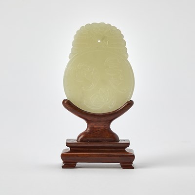 Lot 414 - A Chinese Carved Celadon Jade Pendant