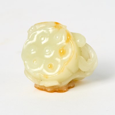 Lot 12 - A Chinese White Jade Carving of a Lotus Pod