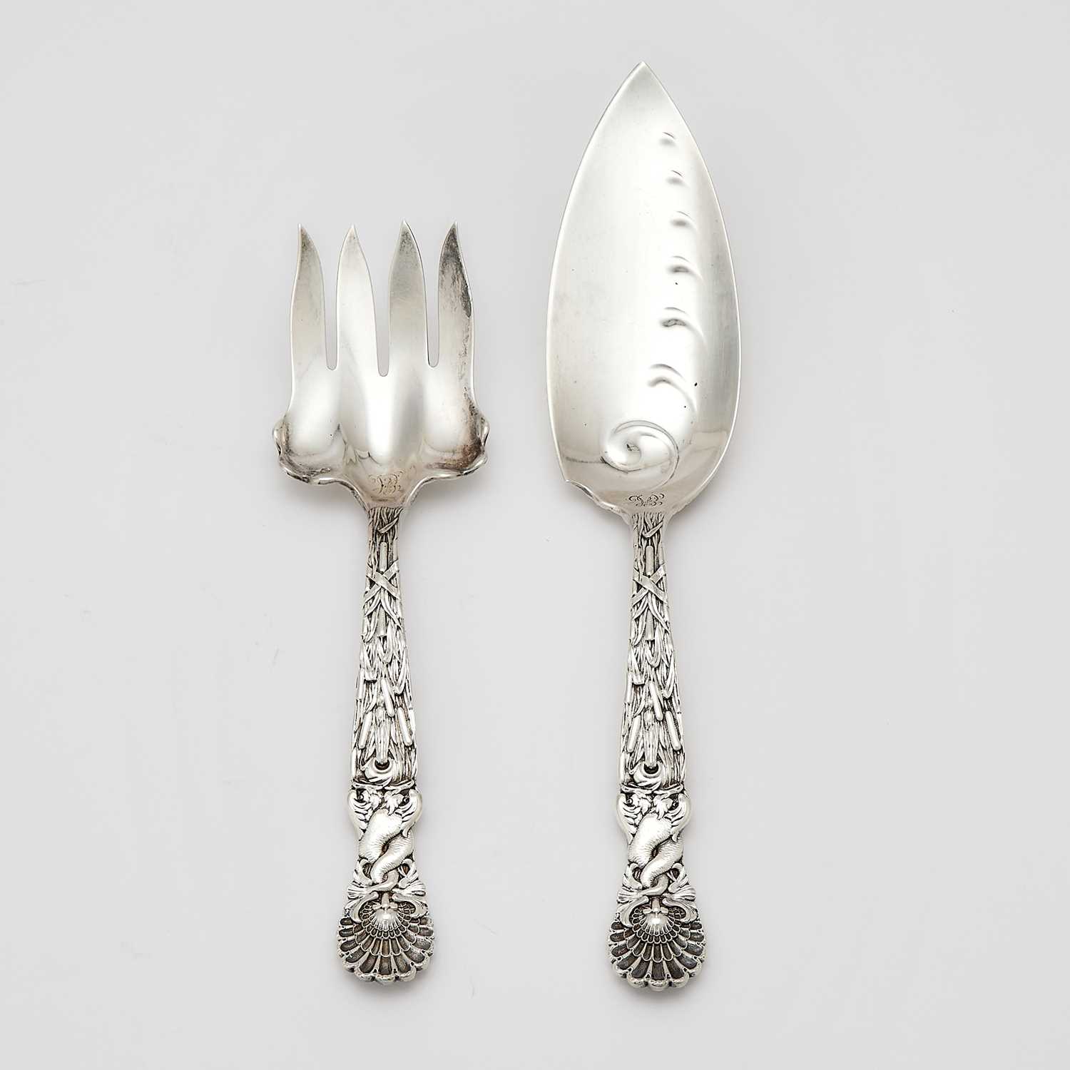 Lot 138 - Two Tiffany & Co. Sterling Silver “Dolphin” Pattern Fish Servers