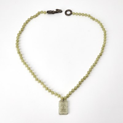 Lot 440 - A Chinese Jade Beaded Necklace