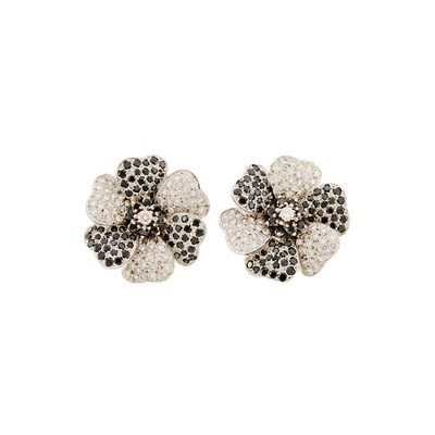 Lot 2138 - Pair of White Gold, Treated Dark Blue Diamond and Diamond Flower Earclips