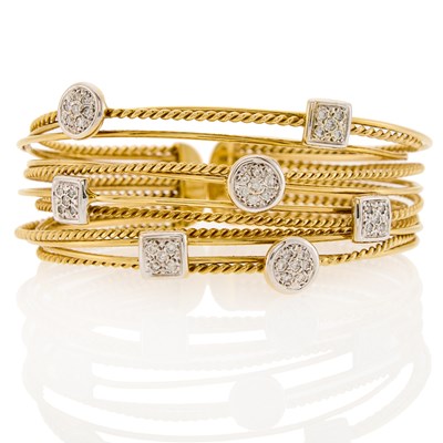 Lot 2013 - Multirow Two-Color Gold and Diamond Bangle Bracelet