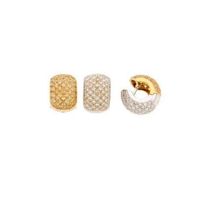 Lot 2170 - Pair of Two-Color Gold, Yellow Sapphire and Diamond Huggie Earrings and Single Earring