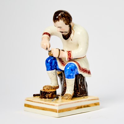 Lot 136 - Russian Porcelain Figure of a Bast Shoemaker