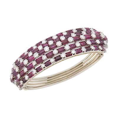 Lot 1101 - White Gold, Ruby and Diamond Bombé Bangle Bracelet