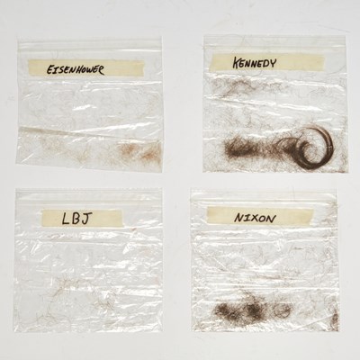 Lot 267 - An unusual album of Presidential hair from the White House barber
