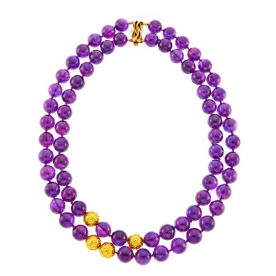 Lot 1027 - Double Strand Amethyst and Low Karat Gold Bead Necklace