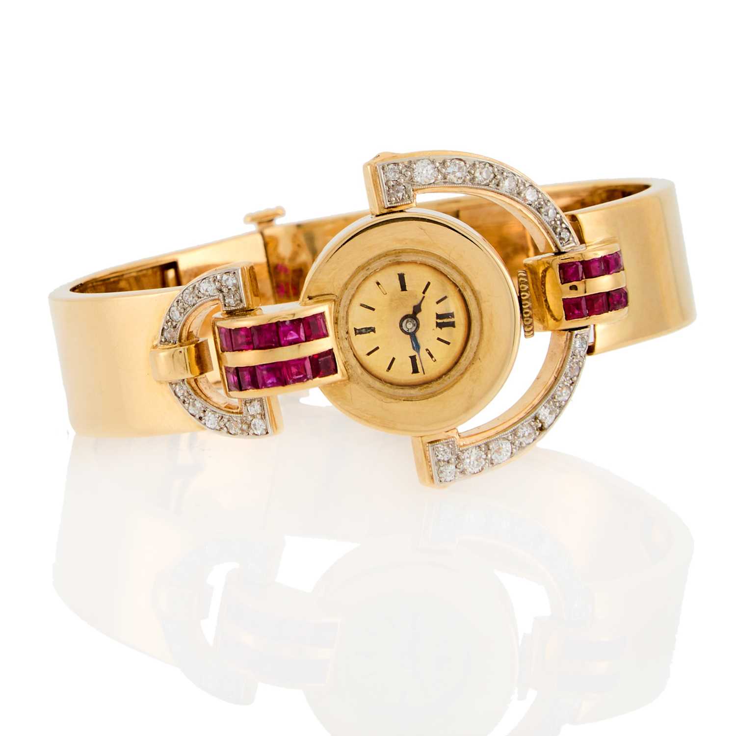 Lot 2187 - Gold, Ruby and Diamond Bangle Watch