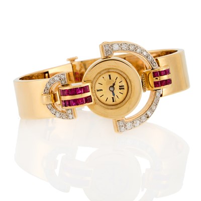Lot 2187 - Gold, Ruby and Diamond Bangle Watch