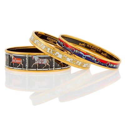 Lot 2083 - Hermès Three Gilt-Metal and Enamel Bangle Bracelets