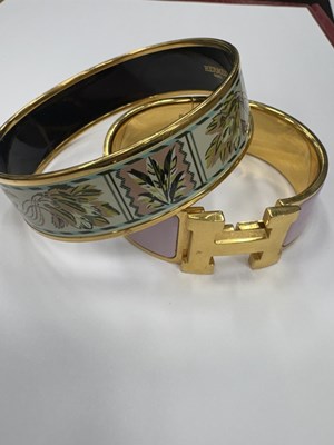 Lot 2077 - Hermès Two Gilt-Metal and Enamel Bangle Bracelets