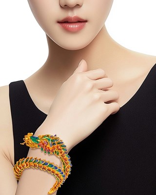 Lot 1230 - Gold, Multicolored Enamel and Ruby Coiled Dragon Bracelet
