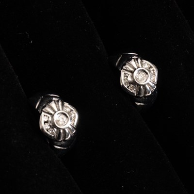 Lot 146 - Pair of 14KT White Gold and Diamond Huggie Earrings