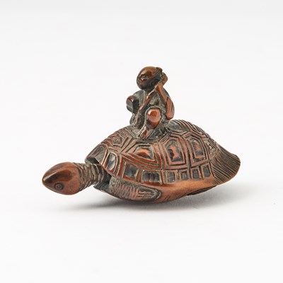 Lot 268 - A Japanese Boxwood Netsuke showing a Tortoise Supporting a Man