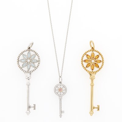 Lot 1086 - Tiffany & Co. Three Gold and White Gold, Colored Stone and Diamond Key Pendants with Platinum Chain Necklace