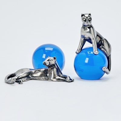 Lot Two Cartier Sterling Silver and Cobalt Blue Glass "Panther and Ball" Table Ornaments