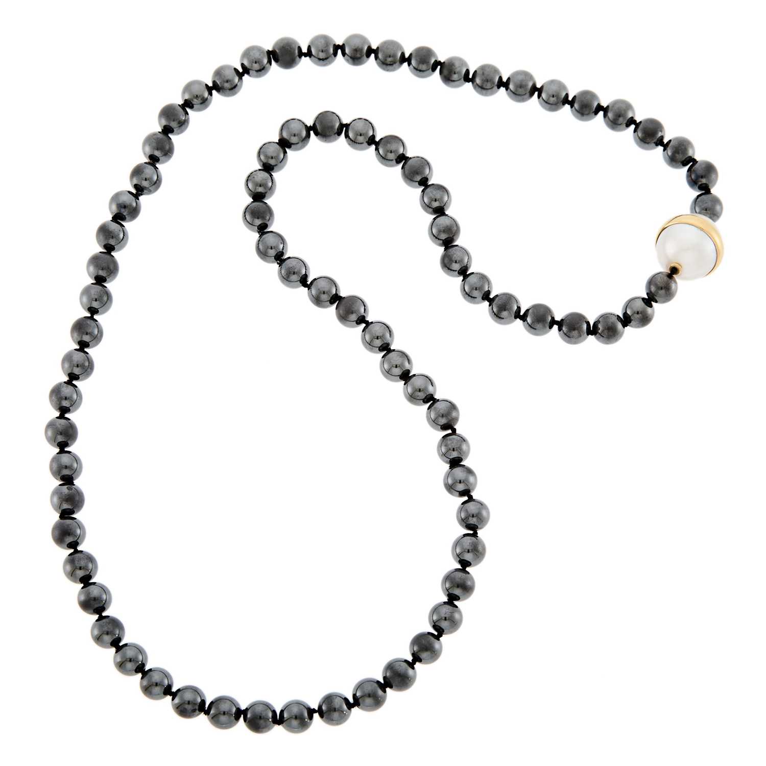 Lot 2239 - Long Hematite Bead, Gold and South Sea Cultured Pearl Necklace