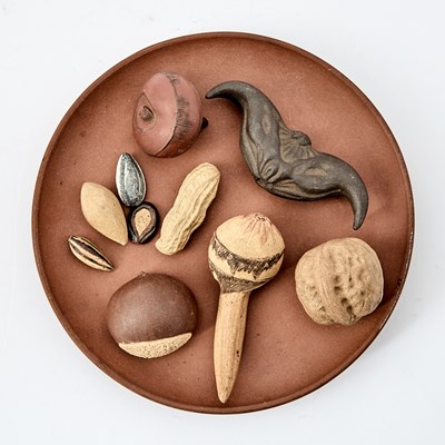 Lot 121 - A Chinese Yixing Pottery Circular Tray with Nuts and Seeds