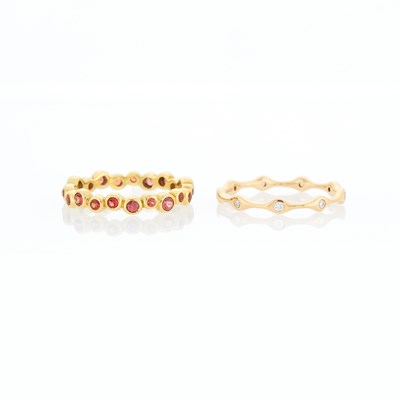 Lot 1244 - Ippolita Two Gold, Rose Gold, Orange Sapphire and Diamond Band Rings