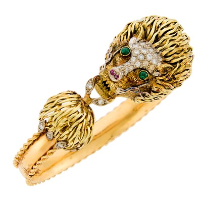 Lot 1209 - Two-Color Gold, Diamond, Cabochon Emerald and Ruby Lions Head Bangle Bracelet