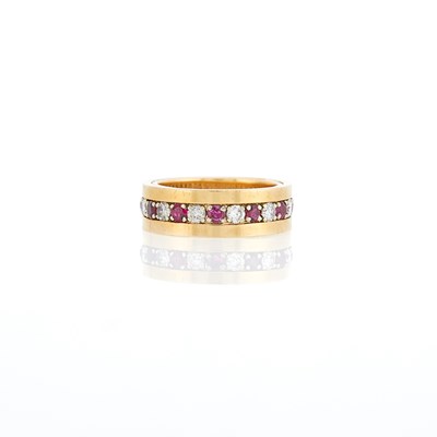 Lot 1274 - Two-Color Gold, Ruby and Diamond Band Ring