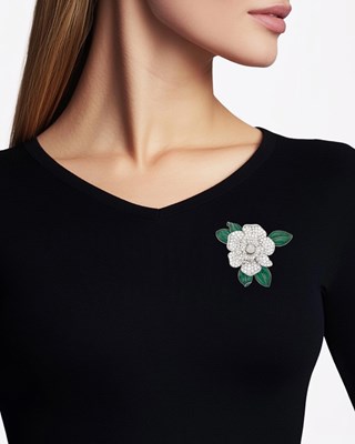 Lot 299 - Oscar Heyman & Brothers Platinum, White Gold, Diamond and Green Enamel 'Gardenia' Clip-Brooch