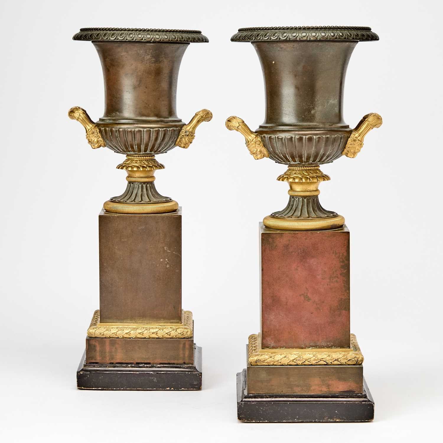 Lot 483 - Pair of Restauration Patinated and Gilt-Bronze Urns on Marble Bases