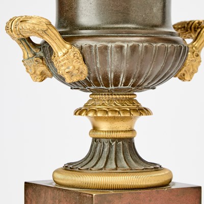 Lot 483 - Pair of Restauration Patinated and Gilt-Bronze Urns on Marble Bases