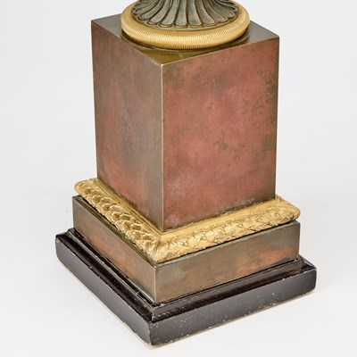 Lot 483 - Pair of Restauration Patinated and Gilt-Bronze Urns on Marble Bases