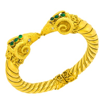 Lot 113 - Gold and Cabochon Emerald Ram's Head Bangle Bracelet