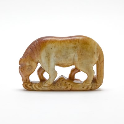 Lot 452 - A Chinese Russet and Celadon Jade Figure of a Horse